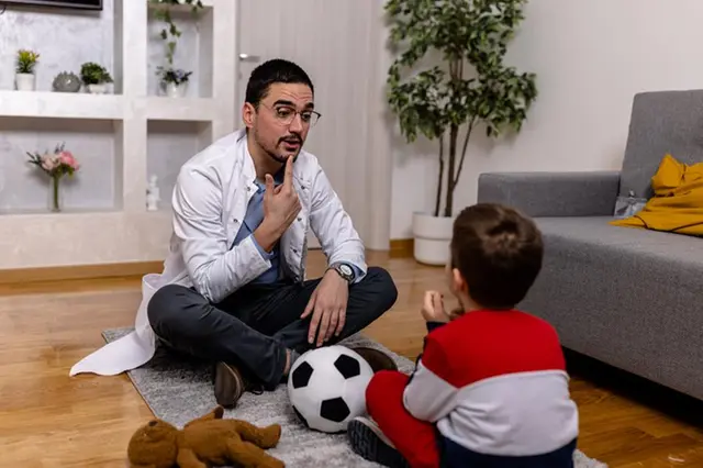 Speech pathologist conducting therapy session with young child in Australia